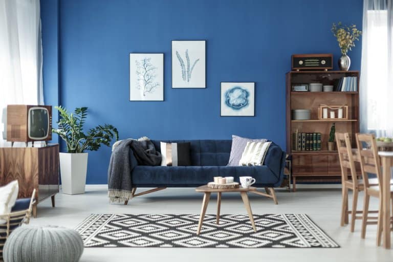 Retro Style Cozy Living Room With Blue Walls And White Floor 768x512 