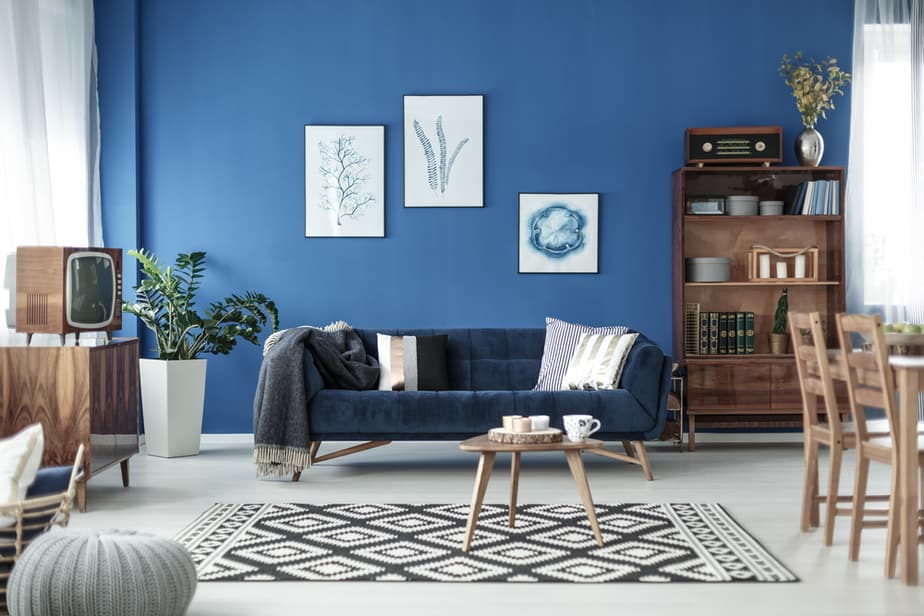 Retro Style Cozy Living Room With Blue Walls And White Floor 