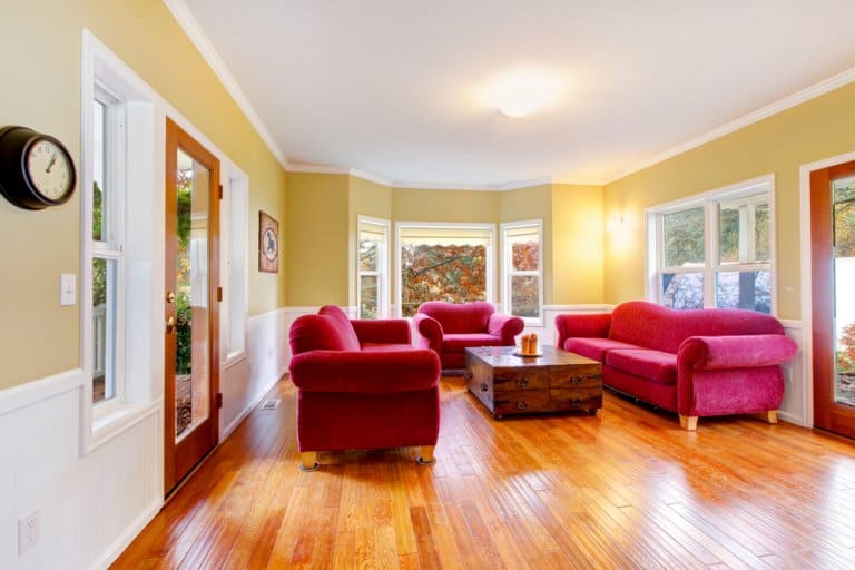 Large Living Room With Hardwood And Pink Red Sofas 768x512 