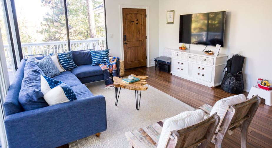 Sectional Blue Couch in An Open Space Area