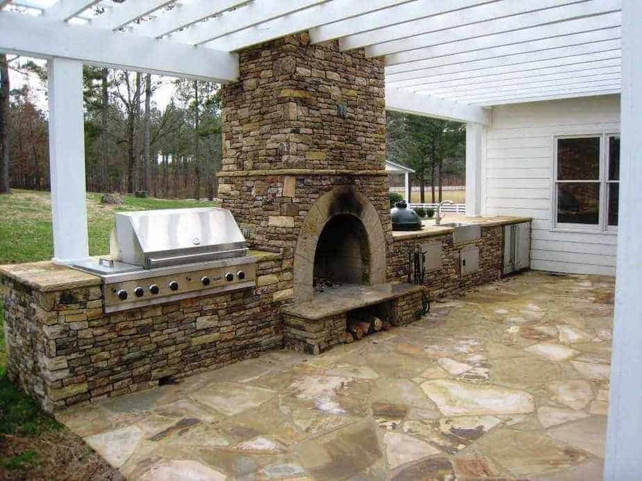 Outdoor Kitchen with Earthy Fireplace