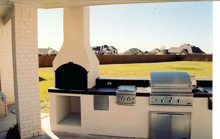 10 Outdoor Kitchen With Fireplace Ideas 2023 The Warmer   Outdoor Kitchen With Modern Fireplace 1024x646 