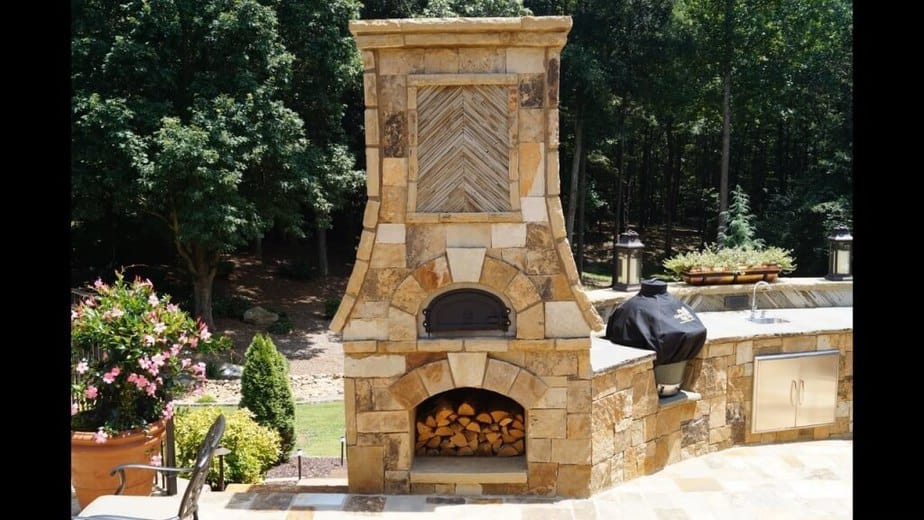 Outdoor Kitchen with Tasteful Fireplace