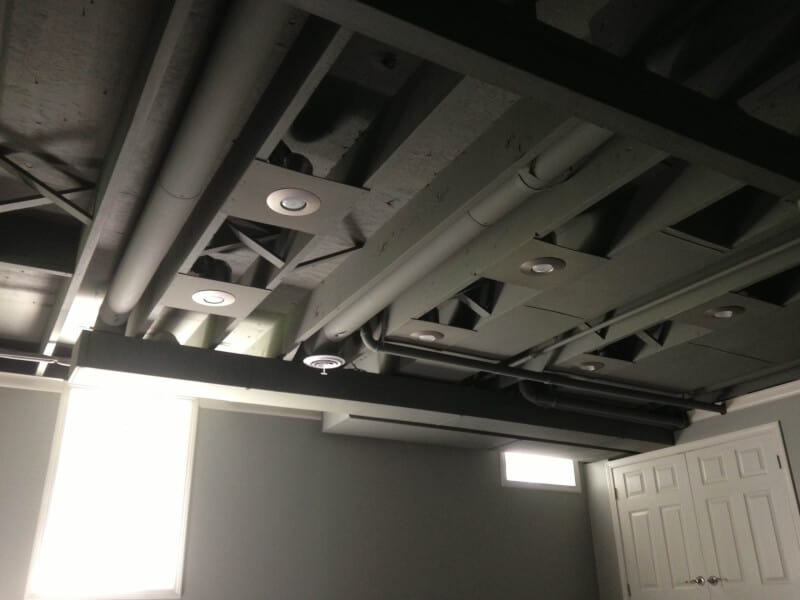 Painted Exposed Basement Ceiling Ideas in dark mode